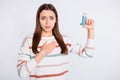 Suffering of bronchospasm lady going to inhale medication wear striped pullover isolated white background