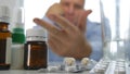 Suffering Man Checking Medical Pills Stock On Pharmacy Shelf