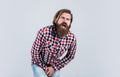 suffering from pain in scrotum brutal bearded man wear checkered shirt having lush beard and moustache, male health Royalty Free Stock Photo