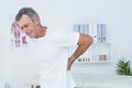 Suffering patient touching his back Royalty Free Stock Photo