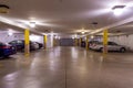 Suffern, NY / United States - March 20, 2020: Horizontal interior view of an apartment building`s garage and storage lockers.