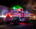 Horizontal view of a decorated Fire DepartmentÃ¢â¬â¢s rescue truck driving in the Suffern Annual