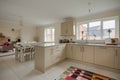 Stylish modern brand new fitted kitchen with dining table