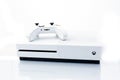 Suffolk, UK June 01 2020: A Microsoft Xbox One S gaming console with a wireless controller shot against a plain white background Royalty Free Stock Photo