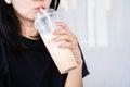 Sugar addiction concept, closeup Asian woman drinking  milk tea , sweet drink Royalty Free Stock Photo