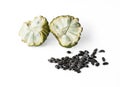 Sugar apple half fruit cutted and black seeds isolated on white background, dicut with clipping path