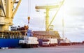 Sugar bags product vessel loading activities, vessel crane lift up bag of white sugar from truck load into vessel hatch. Royalty Free Stock Photo