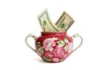 Sugar basin with dollar bills isolated Royalty Free Stock Photo