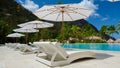 Sugar beach Saint Lucia ,white tropical beach palm trees and luxury beach chairs St Lucia Caribbean Royalty Free Stock Photo