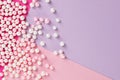 Sugar candy scattered on pastel colored background