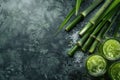 Sugar Cane Freshly Squeezed Juice with Sugar Cane Branches on Blurred Background, Sugarcane Juice Royalty Free Stock Photo