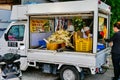 A sugar cane juice seller in a van with a customer in Georgetown, Penang Malaysia