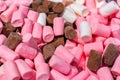 Sugar-coated marshmallows, pink white brown chocolate closeup. Sweet dessert background wallpaper backdrop Royalty Free Stock Photo