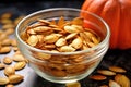 sugar-coated roasted pumpkin seeds in a glass bowl