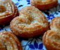 Sugar Cookies on a plate. A close-up of heart shaped cookie placed on a table. Royalty Free Stock Photo