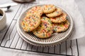 Sugar cookies with sprinkles, colorful coffee treat. Royalty Free Stock Photo