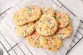 Sugar cookies with sprinkles, colorful coffee treat. Royalty Free Stock Photo