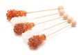 Sugar crystal on wooden stick isolated on white background. Royalty Free Stock Photo