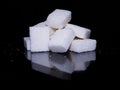 Sugar cubes isolated in black background Royalty Free Stock Photo