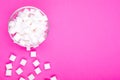 Sugar cubes on pink background