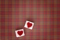 Sugar cubes with a red heart on them. Top view. Sweet addiction valentine day concept Royalty Free Stock Photo