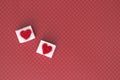 Sugar cubes with a red heart on them. Top view. Sweet addiction valentines day concept Royalty Free Stock Photo