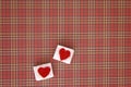 Sugar cubes with a red heart on them. Top view. Sweet addiction valentines day concept Royalty Free Stock Photo