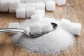 sugar cubes in spoon on table wood Royalty Free Stock Photo