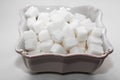 Sugar cubes in a white square bowl Royalty Free Stock Photo