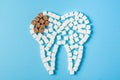 Sugar destroys the tooth enamel and leads to tooth decay. Tooth made of white and caries made of brown sugar cubes. Royalty Free Stock Photo