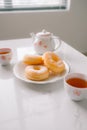 sugar donut and tea on white background Royalty Free Stock Photo