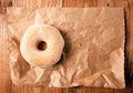 Sugar doughnut on crumpled paper