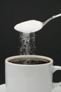 Sugar falling from a spoon Royalty Free Stock Photo