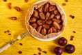 Sugar free pie with plums and raisins on a white plate on yellow wooden background decorated with three fresh plums Royalty Free Stock Photo