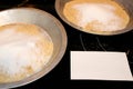 Making pie crust in pie tin with blank recipe card Royalty Free Stock Photo