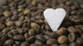 Sugar heart with coffee beans background abstract with copyspace for love