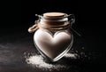 sugar in heart shaped glass jar on black surface - diabetes health care concept