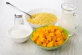 Sugar, millet, spoon in bowl, pumpkin in bowls, salt, milk Royalty Free Stock Photo