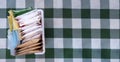 Sugar packets on a Checkered white and green table cloth Royalty Free Stock Photo