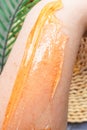 Sugar paste is applied to the hand to remove hair. Waxing at home. Sugaring close-up