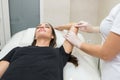 Sugar paste hair removal procedure - shugaring. Cosmetologist applies sugar paste to the hand of a young woman Royalty Free Stock Photo