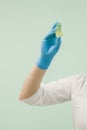 Sugar paste for shugaring in the hand of a cosmetologist in a blue glove Royalty Free Stock Photo