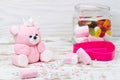 Sugar pink bear cub and candies in jar