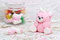 Sugar pink bear cub and candies in jar Royalty Free Stock Photo