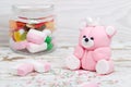 Sugar pink bear cub and candies in jar