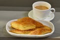 Sugar puff pastry or sugar khari with a cup of tea Royalty Free Stock Photo