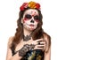 Sugar skull makeup. Halloween party, traditional Mexican carnival, Santa Muerte. Beautiful young woman costume