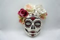 Sugar skull mask with flowers used for celebrating Day of the Dead in hispanic culture