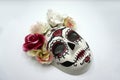 Sugar skull mask with flowers used for celebrating Day of the Dead in hispanic culture