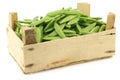 Sugar snaps in a wooden crate